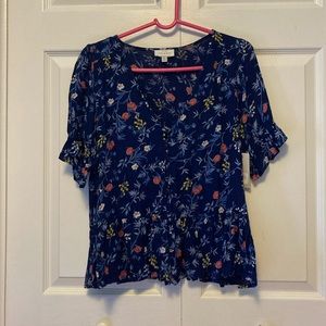 Cute lightweight peplum top with button detail